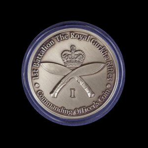 Custom military challenge coin for the 1st Battalion The Royal Gurkha Rifles, featuring crossed kukri knives, a royal crown and Commanding Officer’s Coin inscription in an antique silver finish.