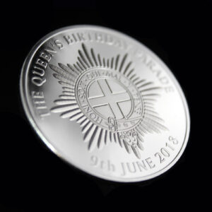 Silver colour semi-proof commemorative coin created for The Queen’s Birthday Parade 2018, featuring the Coldstream Guards star badge and regimental insignia. A bespoke military commemorative coin designed to celebrate ceremonial service and historic occasions.