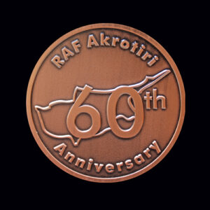 RAF Akrotiri 60th Anniversary commemorative coin in an antique bronze finish, featuring the outline of Cyprus and bold 60th anniversary design. A bespoke military challenge coin created to celebrate six decades of RAF Akrotiri’s history, service and operational excellence.