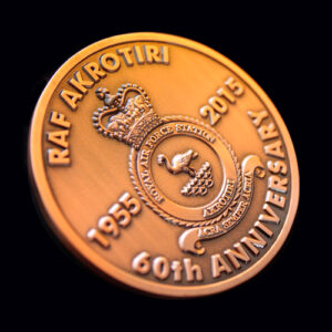 RAF Akrotiri 60th Anniversary commemorative coin in antique bronze finish featuring the RAF Akrotiri station crest, crown emblem and anniversary dates 1955–2015. A bespoke military challenge coin created to celebrate six decades of RAF service, heritage and operational excellence.