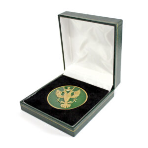 Mercian Regiment commemorative coin presented in a premium hinged display box, featuring a detailed heraldic eagle emblem on a green enamel background with an antique finish. Ideal for military recognition, commemorative presentations and ceremonial awards.